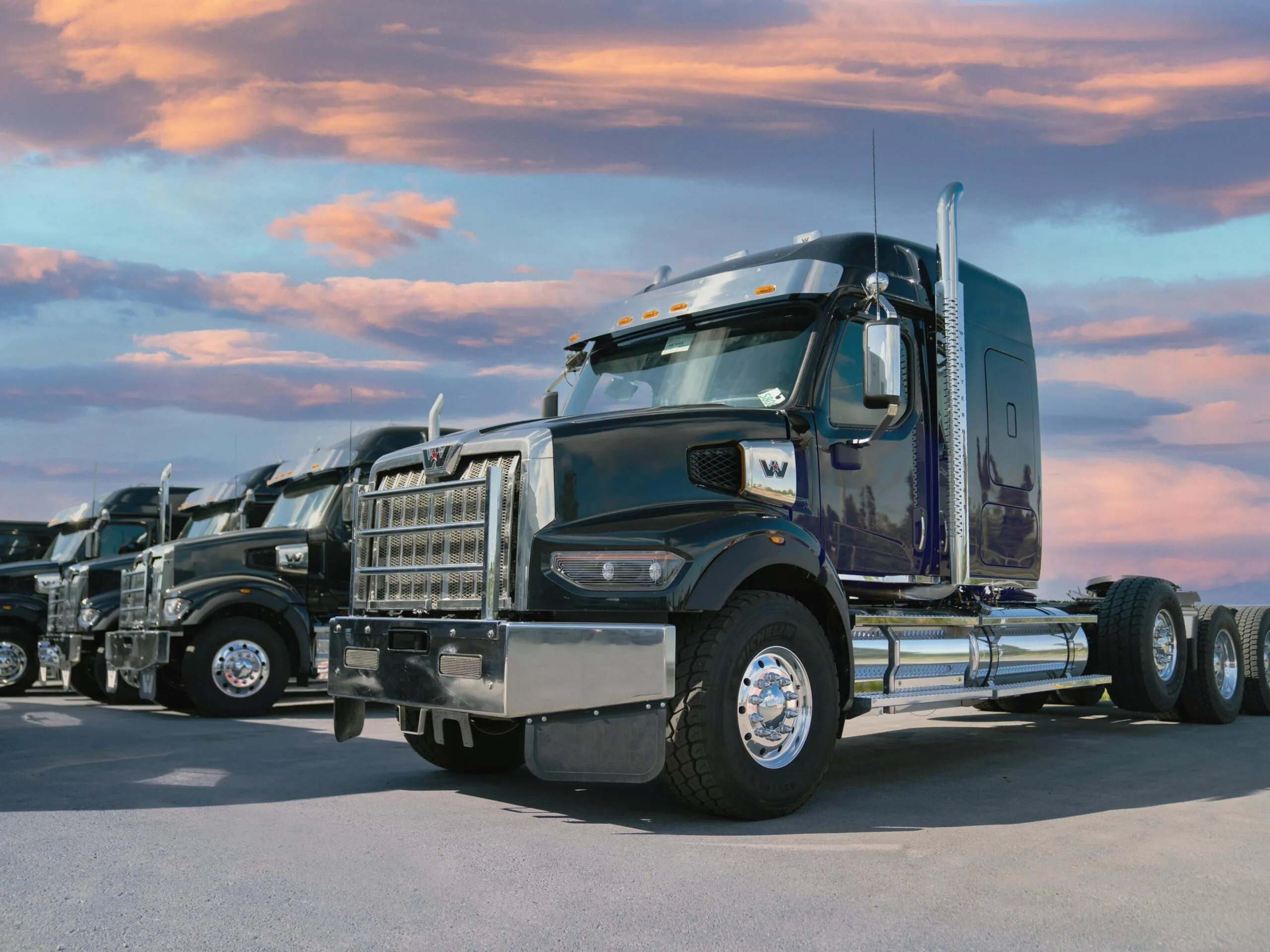 Freightliner truck outside TrailerCraft's Alaska dealership at dusk